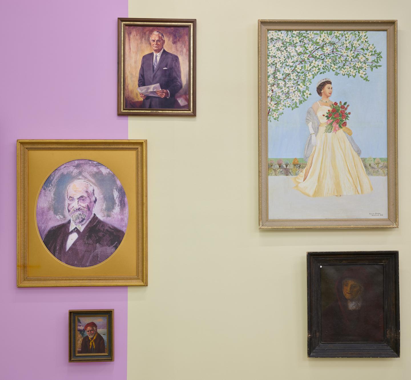 Five painted portraits with washed out tones begin to resonate against the light fuchsia and dust yellow wall panels. The sunset sky behind a sailor tones with a businessman’s suit and a yellow satin dress echoes the yellowing skin of an elderly nun.