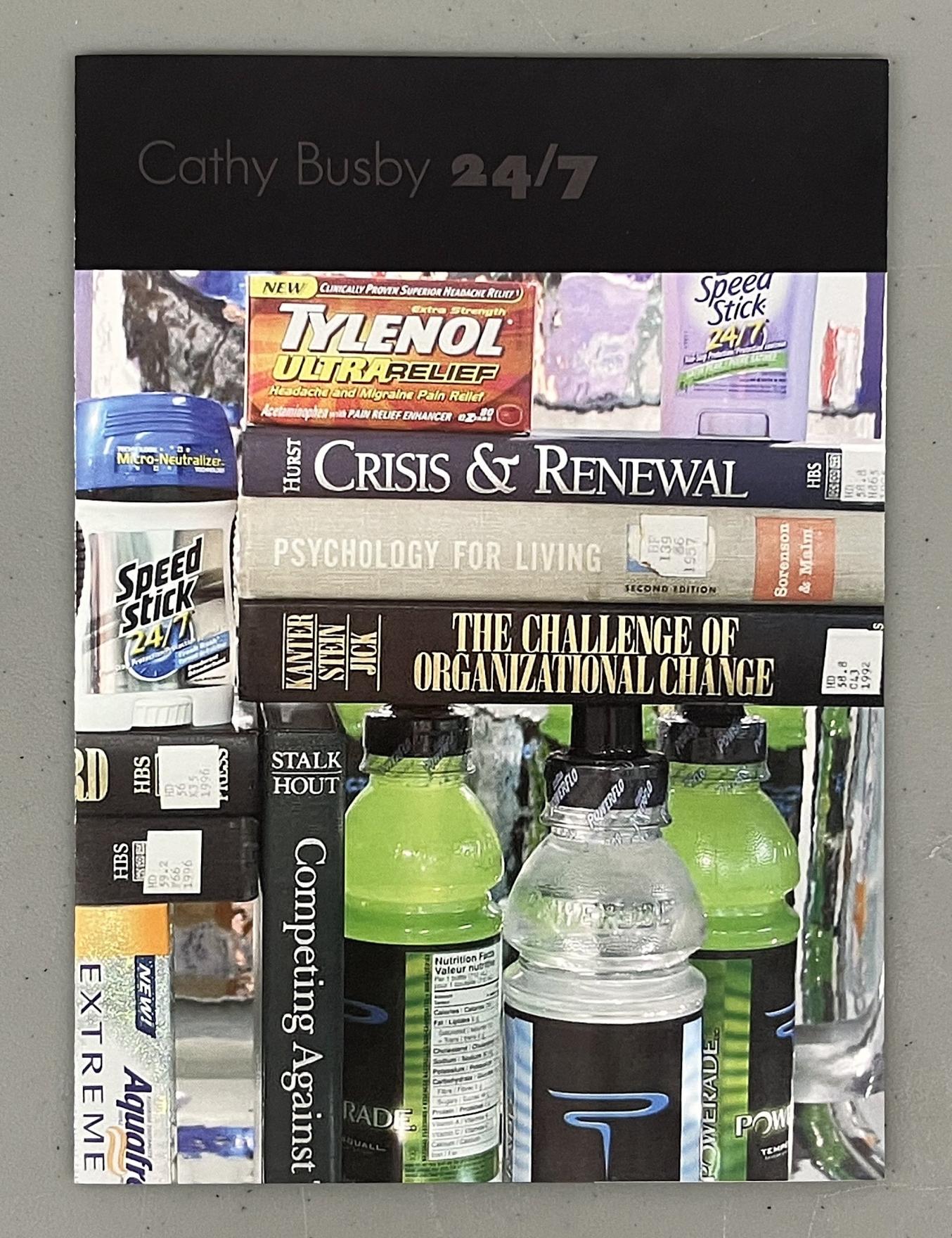 A collage of brand images and self help books fill the page of a thin pamphlet which rests on a grey background. A black band with grey text reading Cathy Busby 24/7 fills the top of the page, below the title are images of Tylenol Extra Strength tablets, Speed Stick 24/7 deodorant, and toxic waste green Gatorade positioned between various books with titles like Crisis & Renewal, Psychology for Living, and The Challenge of Organizational Change. 