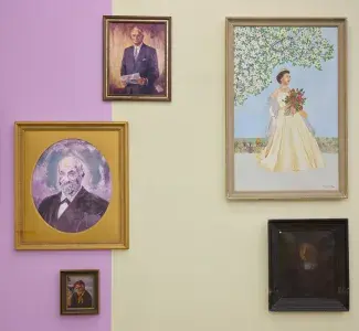 Five painted portraits with washed out tones begin to resonate against the light fuchsia and dust yellow wall panels. The sunset sky behind a sailor tones with a businessman’s suit and a yellow satin dress echoes the yellowing skin of an elderly nun.
